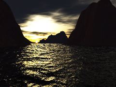 Sun sinking through the strait on a calm day